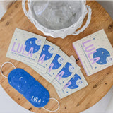 Lula self-warming lavender eye mask, soft fabric covering the eyes, designed for relaxation and soothing sleep.