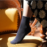 Blue glitter lurex socks by Klue, featuring a shiny, textured fabric with a comfortable sock design.