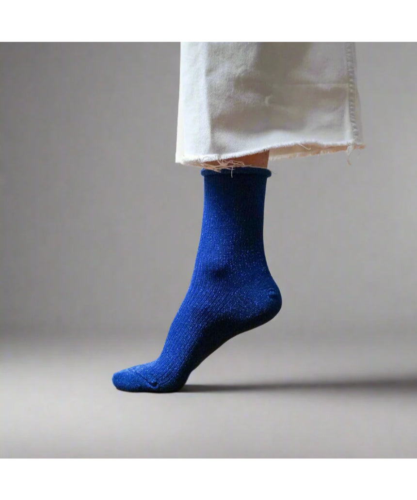 Electric blue glitter lurex socks by Klue featuring shiny, textured fabric and a comfortable fit for stylish casual wear.