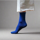 Electric blue glitter lurex socks by Klue featuring shiny, textured fabric and a comfortable fit for stylish casual wear.