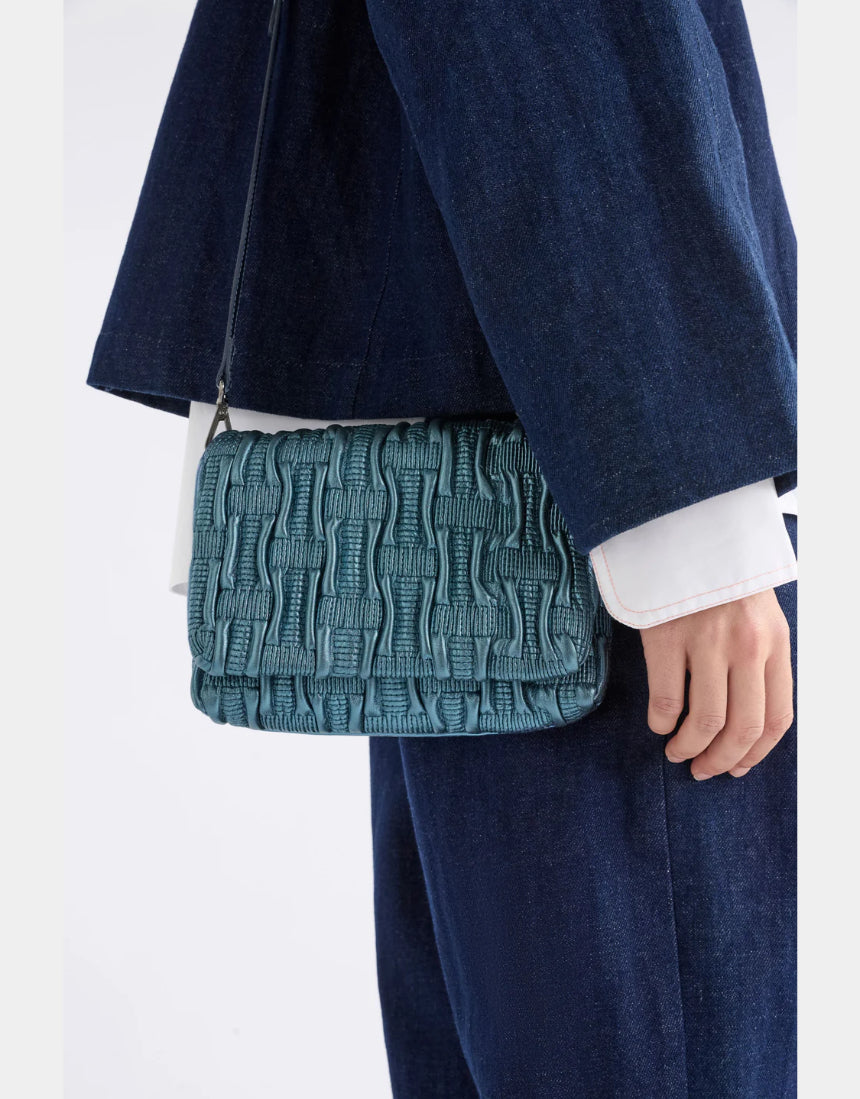 Elk Liska crossbody bag in navy, showcasing a sleek design with adjustable strap and minimalist style.