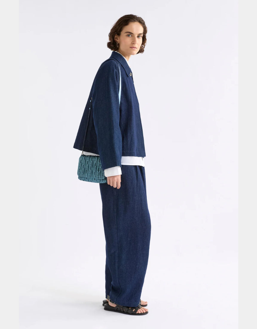 Elk Liska navy crossbody bag with adjustable strap and zippered compartment, made of durable fabric.