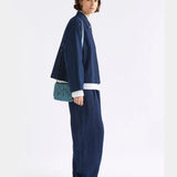 Elk Liska navy crossbody bag with adjustable strap and zippered compartment, made of durable fabric.
