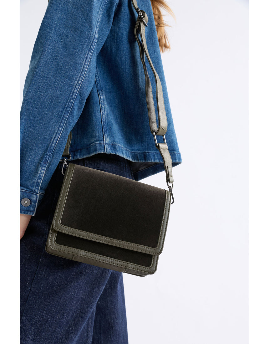 Dark olive ELK The Label Vel crossbody bag with sleek design, adjustable strap, and compact shape for everyday wear.