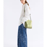 Olive green ELK The Label Bolenn Crossbody Bag with adjustable strap and sleek design, featuring a compact, structured shape.