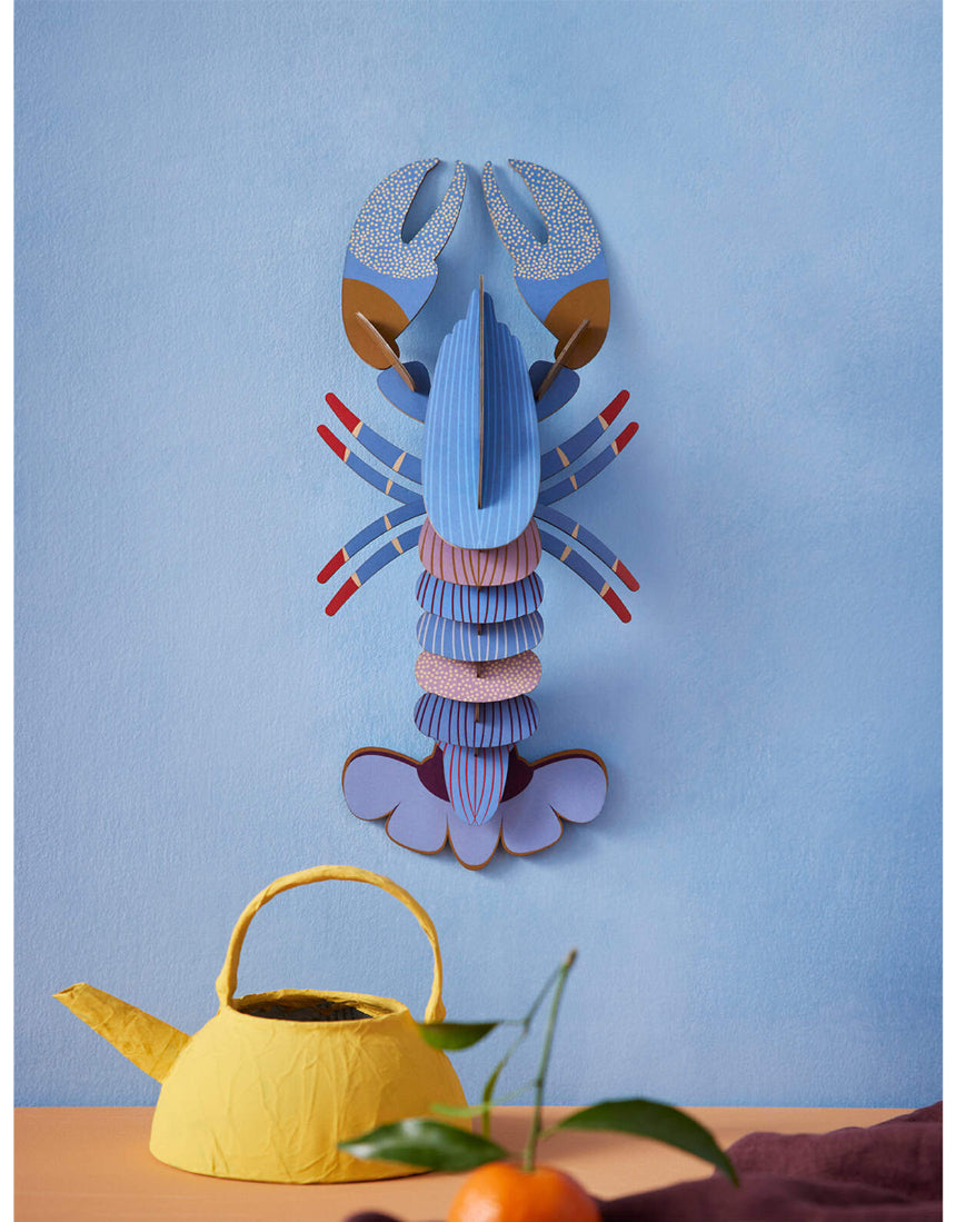 Vertical A4 wall art print by Studio Roof featuring a lavender-colored lobster, perfect for modern marine-inspired decor.