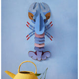 Vertical A4 wall art print by Studio Roof featuring a lavender-colored lobster, perfect for modern marine-inspired decor.