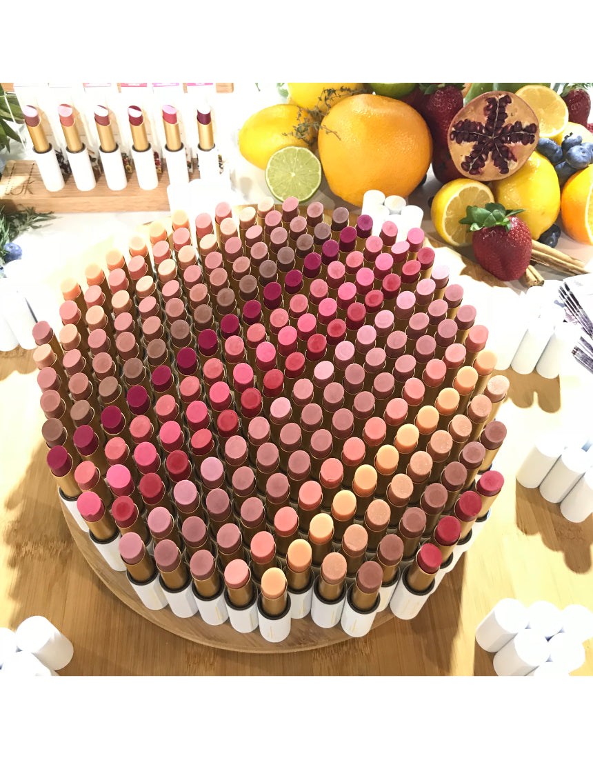 Luk Beautifood Lip Nourish lipstick in Ruby Grapefruit with natural pink and coral tones, shown in a sleek tube.
