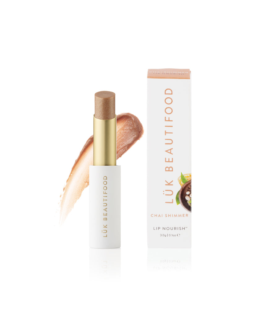 Lük Beautifood Lip Nourish Chai Shimmer lipstick in a warm, shimmering nude shade with natural ingredients and sleek packaging.