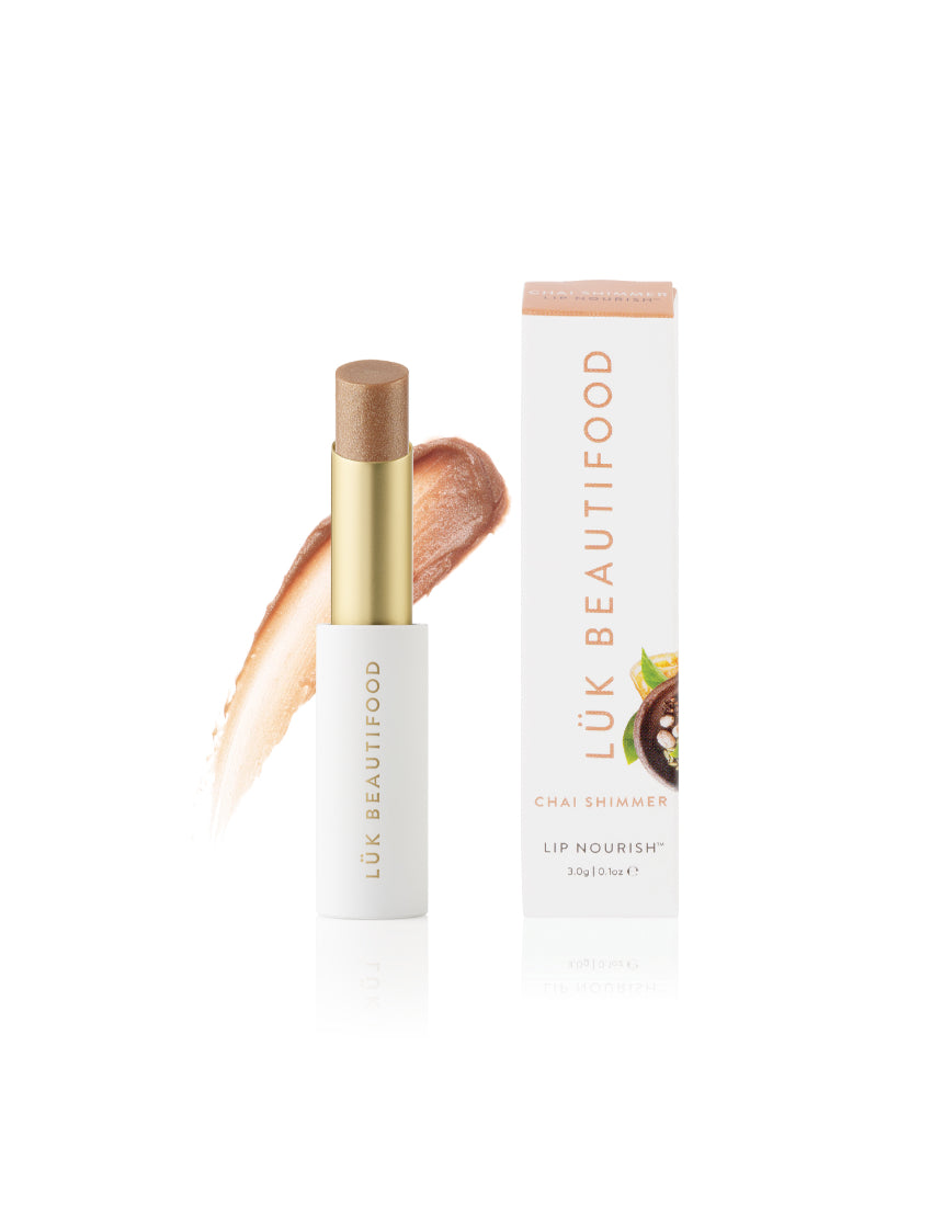 Lük Beautifood Lip Nourish Chai Shimmer lipstick in a warm, shimmering nude shade with natural ingredients and sleek packaging.
