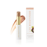 Lük Beautifood Lip Nourish Chai Shimmer lipstick in a warm, shimmering nude shade with natural ingredients and sleek packaging.