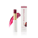 Luk Beautifood Lip Nourish lipstick in Cherry Plum, featuring a rich, natural lipstick tube with the product name visible.