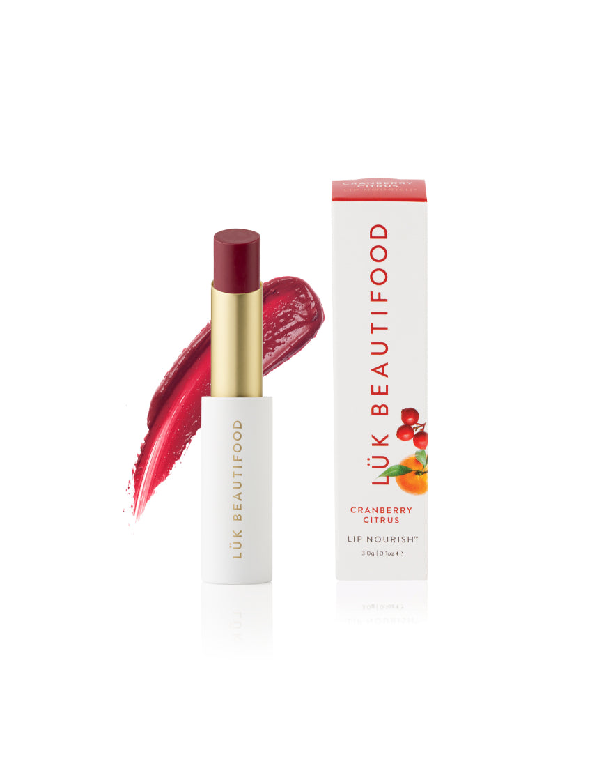 Luk Beautifood Lip Nourish cranberry citrus lipstick in a sleek tube with vibrant red and orange shades.