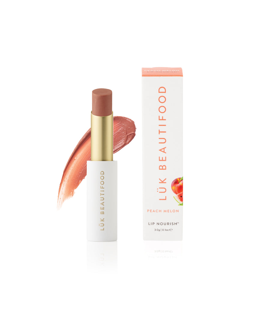 Luk Beautifood Lip Nourish lipstick in Peach Melon, showing a smooth, natural lipstick tube with peach-orange shade.