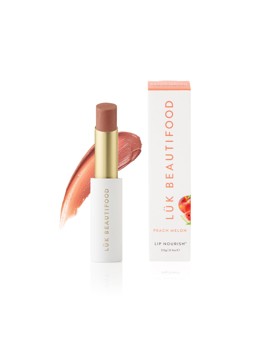 Luk Beautifood Lip Nourish lipstick in Peach Melon, showing a smooth, natural lipstick tube with peach-orange shade.