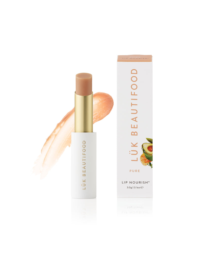 Lük Beautifood Lip Nourish Pure lipstick in a sleek tube, showcasing natural coral shade and smooth, nourishing formula.