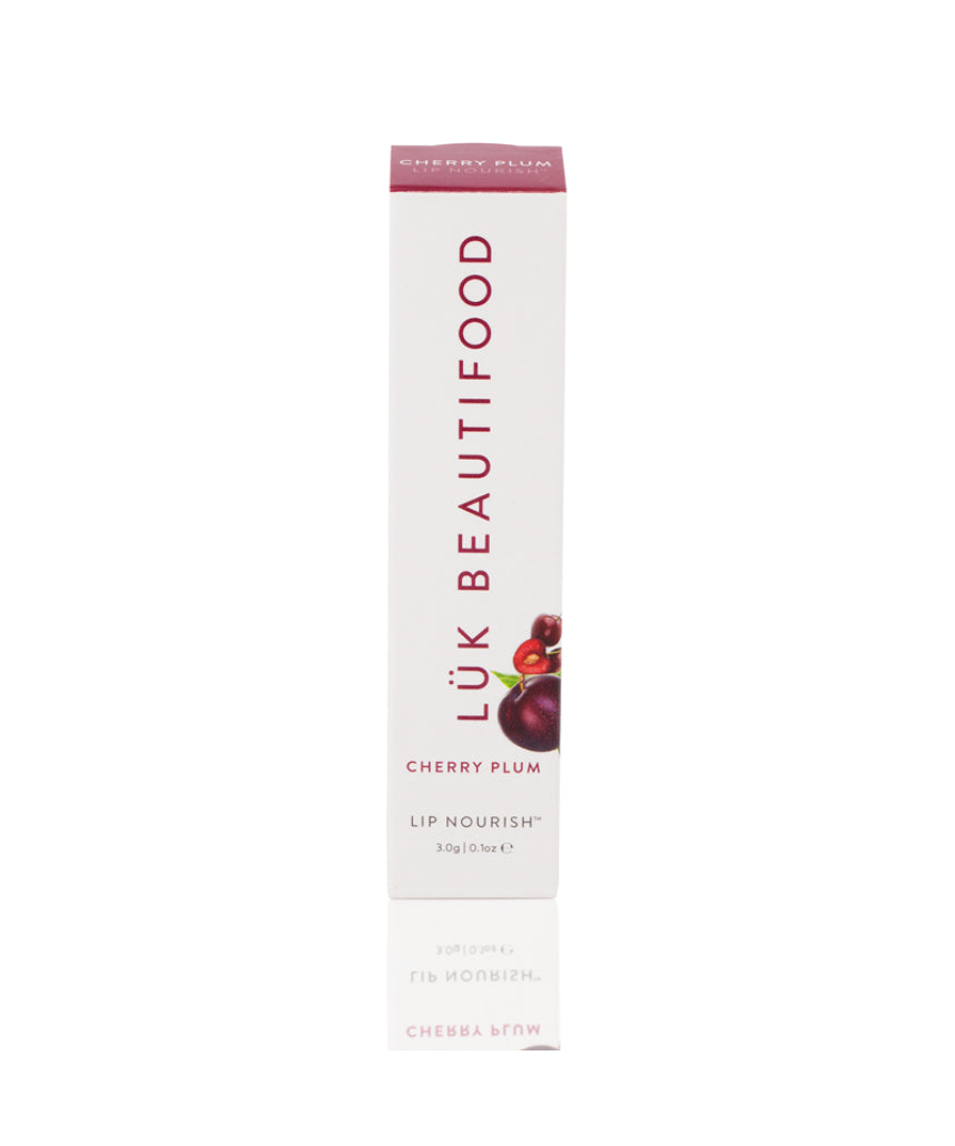 Luk Beautifood Lip Nourish lipstick in Cherry Plum color, featuring a sleek tube and vibrant shade on the lipstick bullet.
