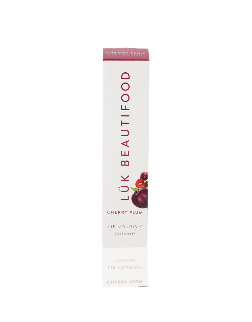 Luk Beautifood Lip Nourish lipstick in Cherry Plum color, featuring a sleek tube and vibrant shade on the lipstick bullet.