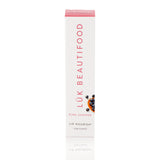 Luk Beautifood Lip Nourish lipstick in Pink Juniper, showing the natural pink shade in the sleek lipstick tube.