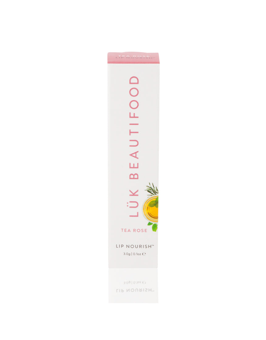 Luk Beautifood Lip Nourish lipstick in Tea Rose shade, showcasing the natural pink lipstick tube with a clear cap and floral branding.