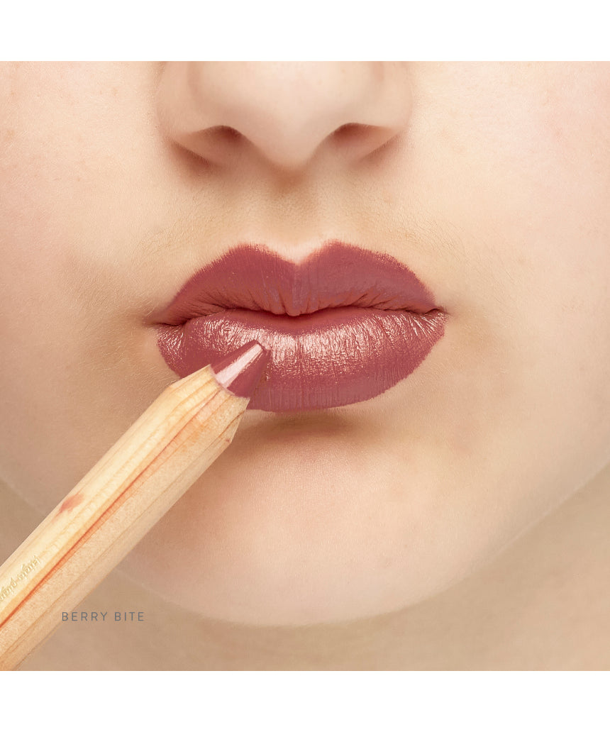 Lük Beautifood Natural Lipstick Crayon in Berry Bite applied on lips, showcasing rich berry color and smooth finish.