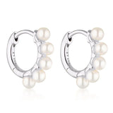 Linda Tahija Wake Pearl silver huggie earrings featuring small pearl accents and sleek hoop design.