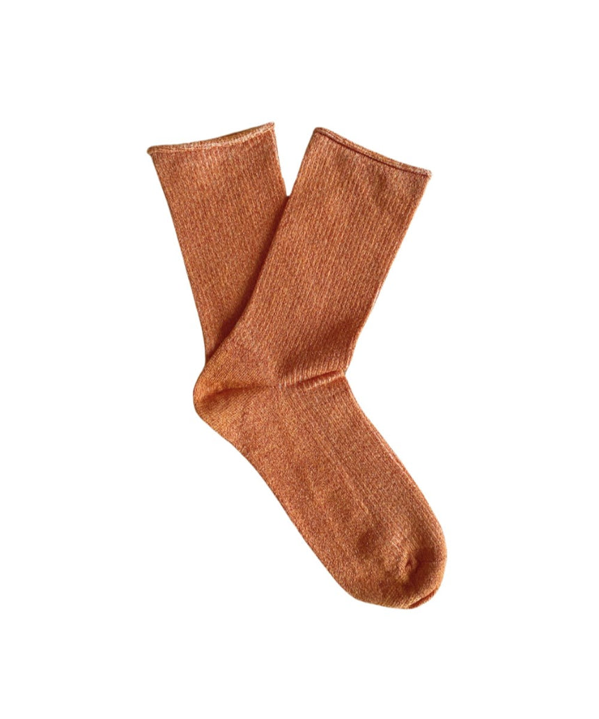 Clutch glitter lurex socks by Klue in terracotta color, featuring a shiny, textured fabric design.
