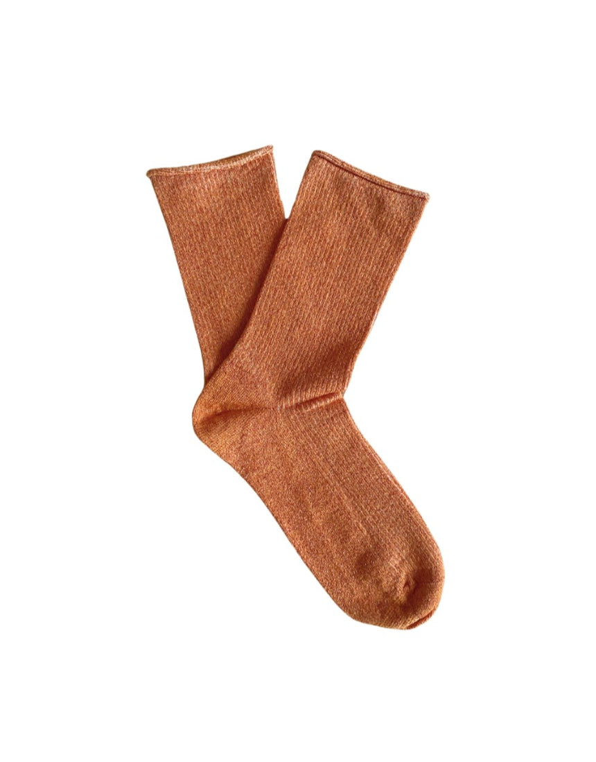 Clutch glitter lurex socks by Klue in terracotta color, featuring a shiny, textured fabric design.