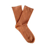 Clutch glitter lurex socks by Klue in terracotta color, featuring a shiny, textured fabric design.
