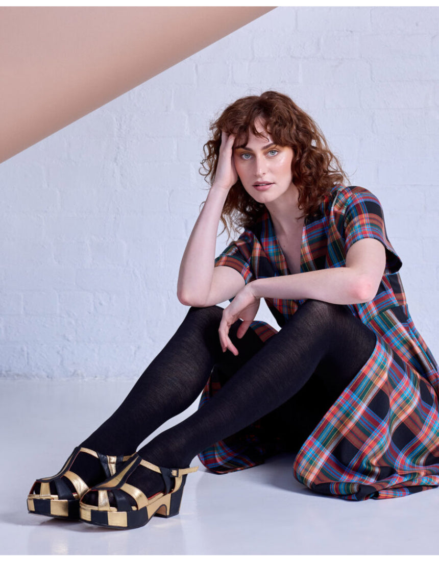 Black Luxe Merino Wool Tights by Tightology, showcasing their sleek fit and soft, high-quality wool fabric.