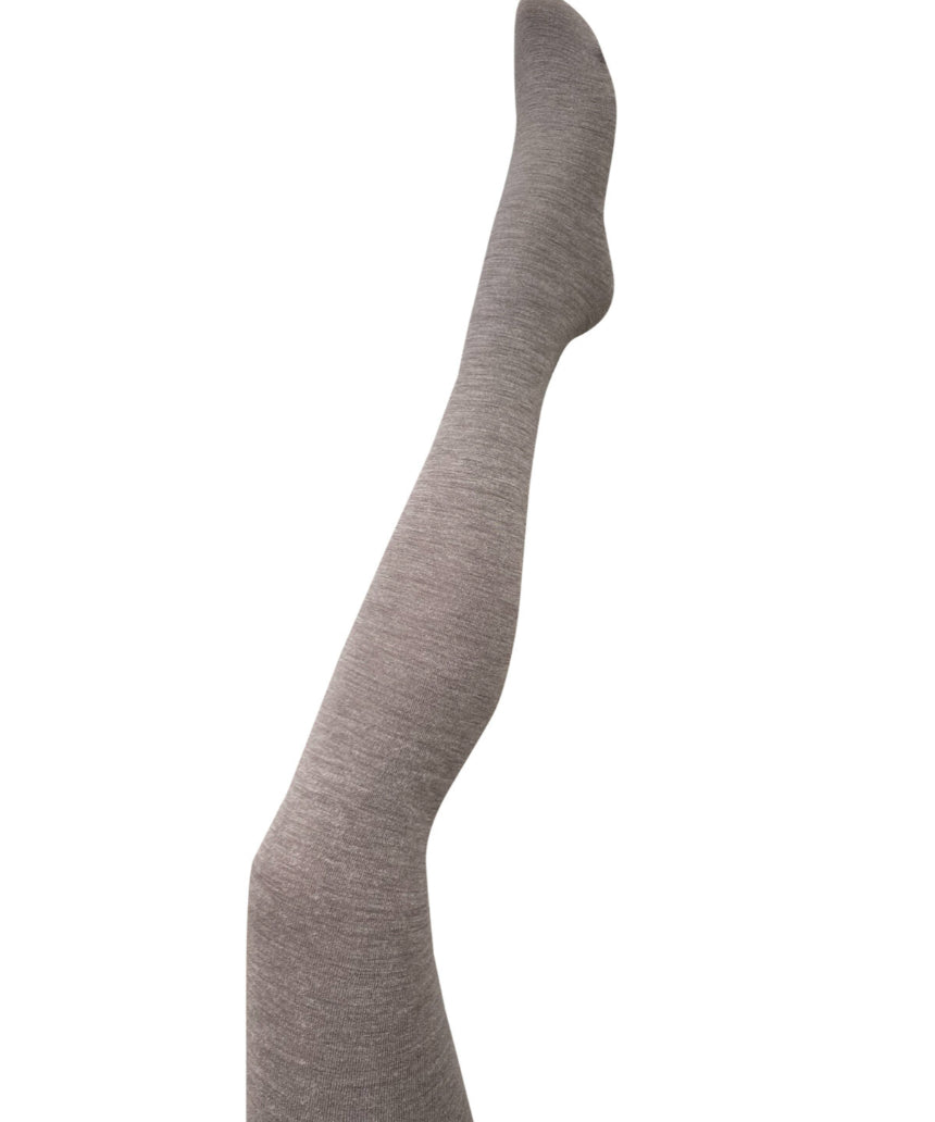 Fawn-colored Luxe Merino Wool Tights by Tightology, close-up of soft, cozy wool fabric and snug fit on model's legs.