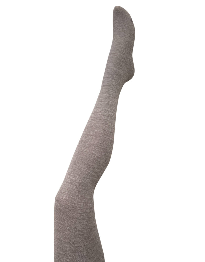Fawn-colored Luxe Merino Wool Tights by Tightology, close-up of soft, cozy wool fabric and snug fit on model's legs.