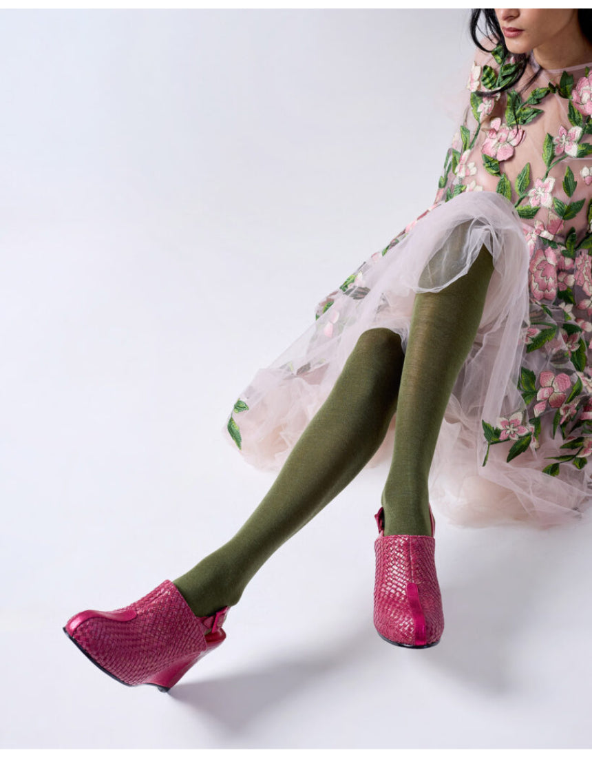 Olive green Luxe Merino Wool Tights by Tightology displayed on a model, showcasing their snug fit and soft wool texture.