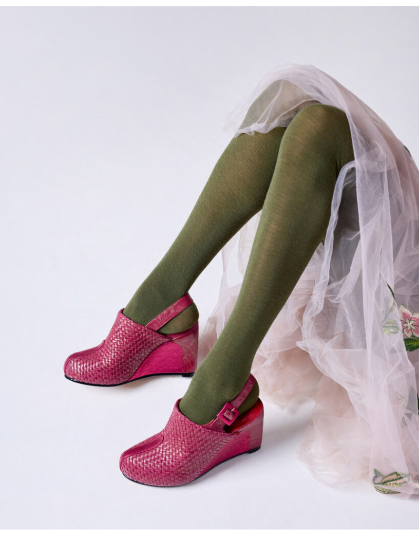 Olive green Luxe Merino Wool Tights by Tightology, close-up of soft, cozy fabric and fitted waistband on a model.