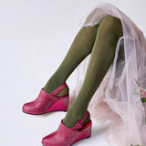 Olive green Luxe Merino Wool Tights by Tightology, close-up of soft, cozy fabric and fitted waistband on a model.
