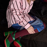 Pair of Luxe Merino Wool Tights by Tightology in deep wine color, showcasing smooth, fitted fabric and stylish design.