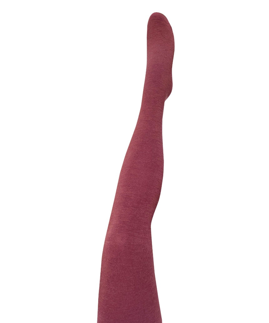 Close-up of Tightology Luxe Merino Wool Tights in wine color, showing the soft, textured fabric and snug fit.