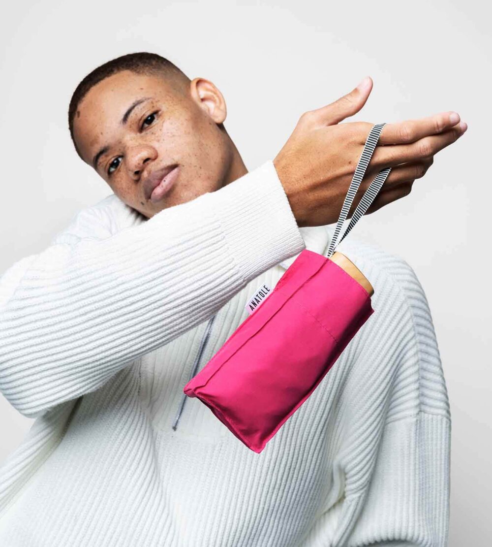 Pink Anatole Suzanne micro-umbrella with compact design, featuring a lightweight, portable umbrella perfect for travel and rainy days.