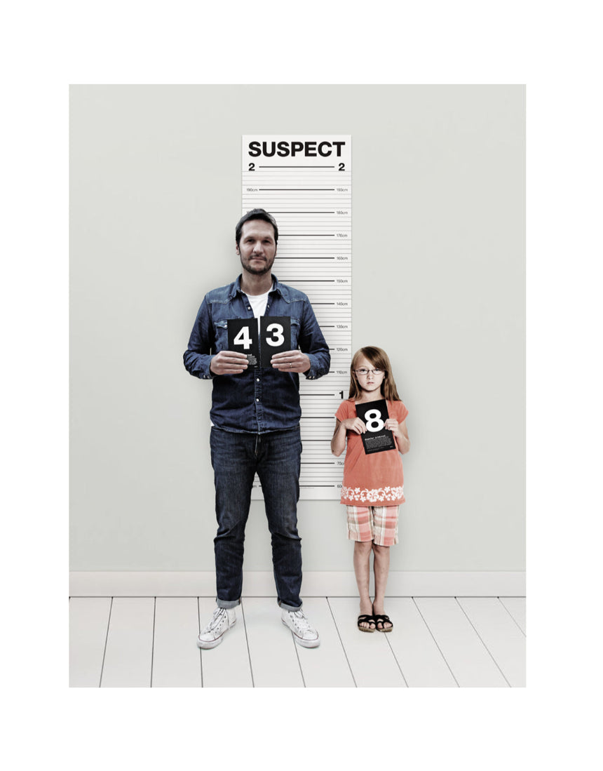 Suck UK Mugshot Height Chart featuring a vintage-style police mugshot layout with height measurements on a white background