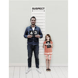 Suck UK Mugshot Height Chart featuring a vintage-style police mugshot layout with height measurements on a white background