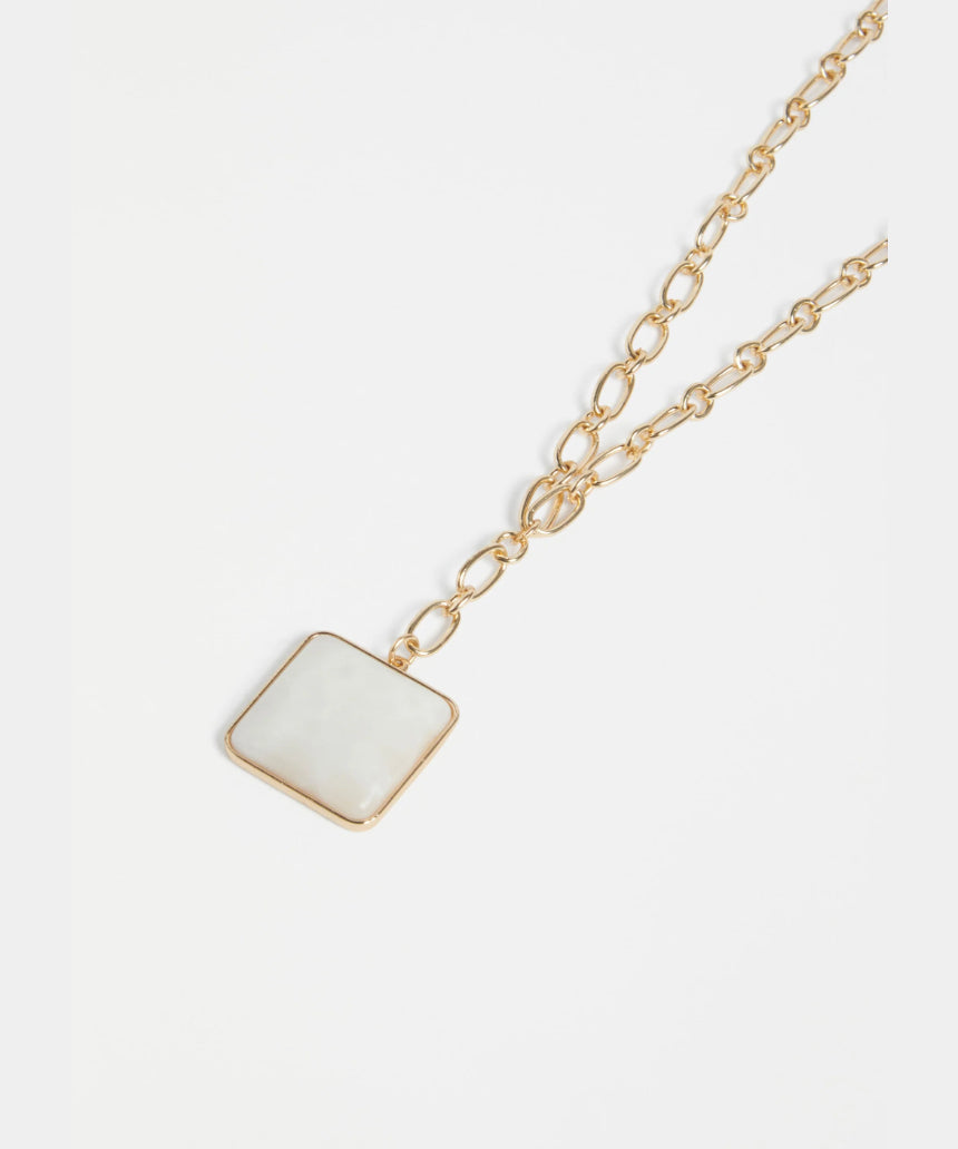 Gold Elk Viri necklace featuring a sleek, minimalist design with a smooth pendant on a delicate chain.