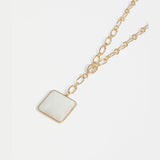 Gold Elk Viri necklace featuring a sleek, minimalist design with a smooth pendant on a delicate chain.