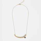 Gold Elk Ahas Necklace featuring a delicate chain and intricate pendant design, showcasing elegant jewelry craftsmanship.