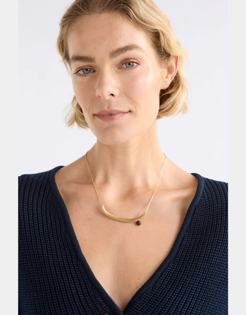 Gold Elk Ahas Necklace featuring intricate pendant and chain design, showcasing elegant jewelry craftsmanship.