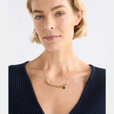 Gold Elk Ahas Necklace featuring intricate pendant and chain design, showcasing elegant jewelry craftsmanship.