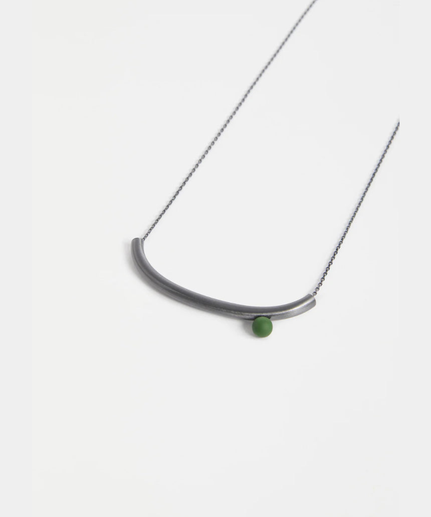 Elk Ahas necklace in gunmetal, featuring a sleek, modern design with a smooth chain and minimalist pendant.