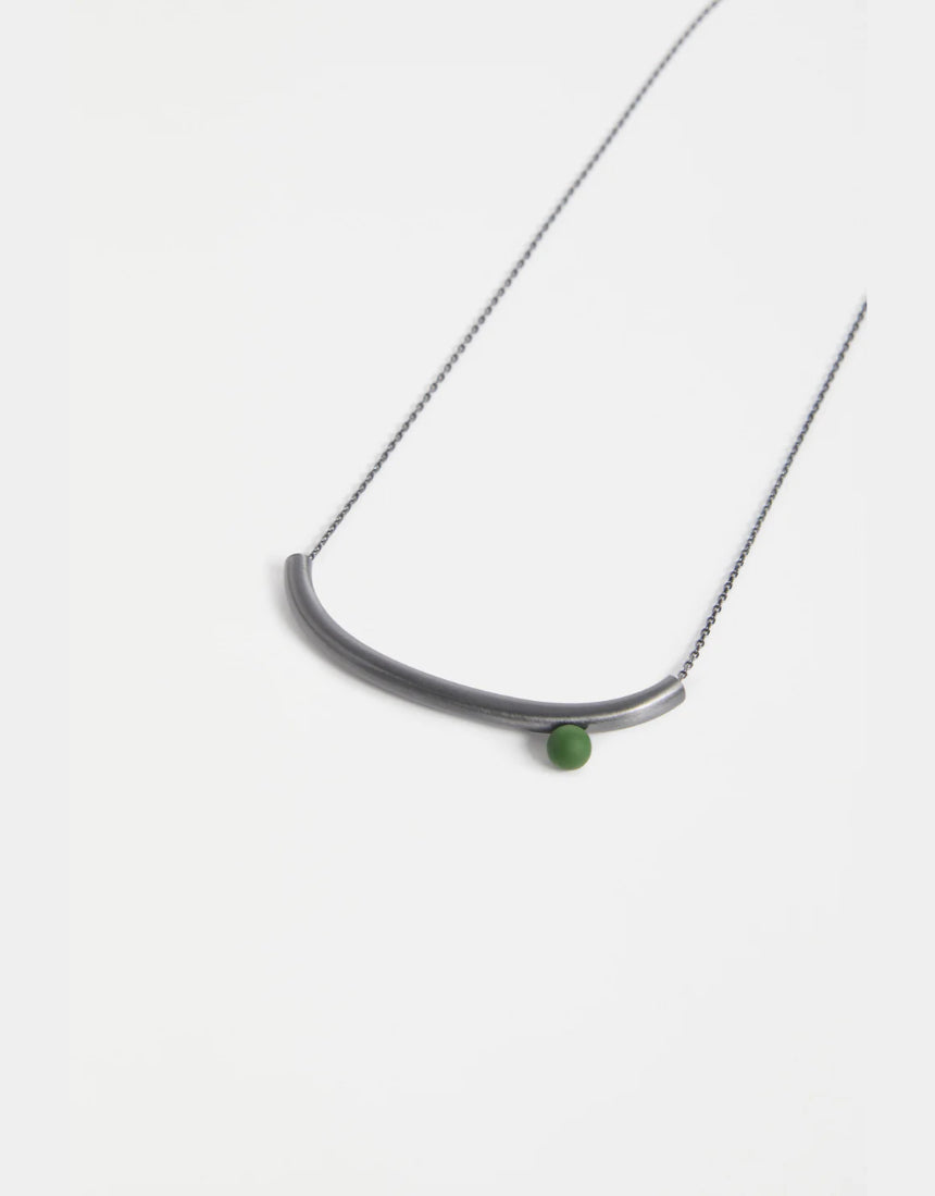 Elk Ahas necklace in gunmetal, featuring a sleek, modern design with a smooth chain and minimalist pendant.