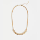 Gold Elk Hulle necklace featuring a sleek, minimalist design with a delicate chain and subtle pendant.