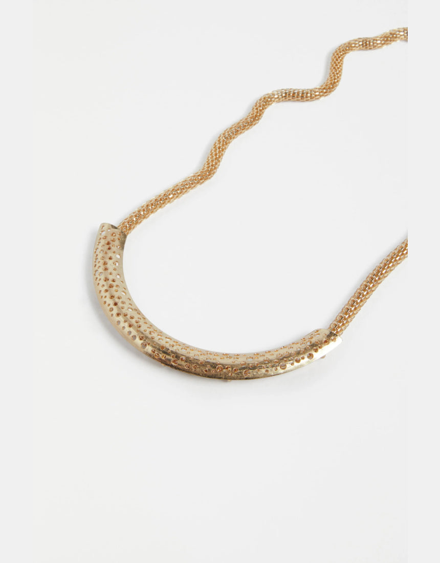 Gold Elk Hulle Necklace featuring a sleek, minimalist design with a delicate chain and subtle pendant.