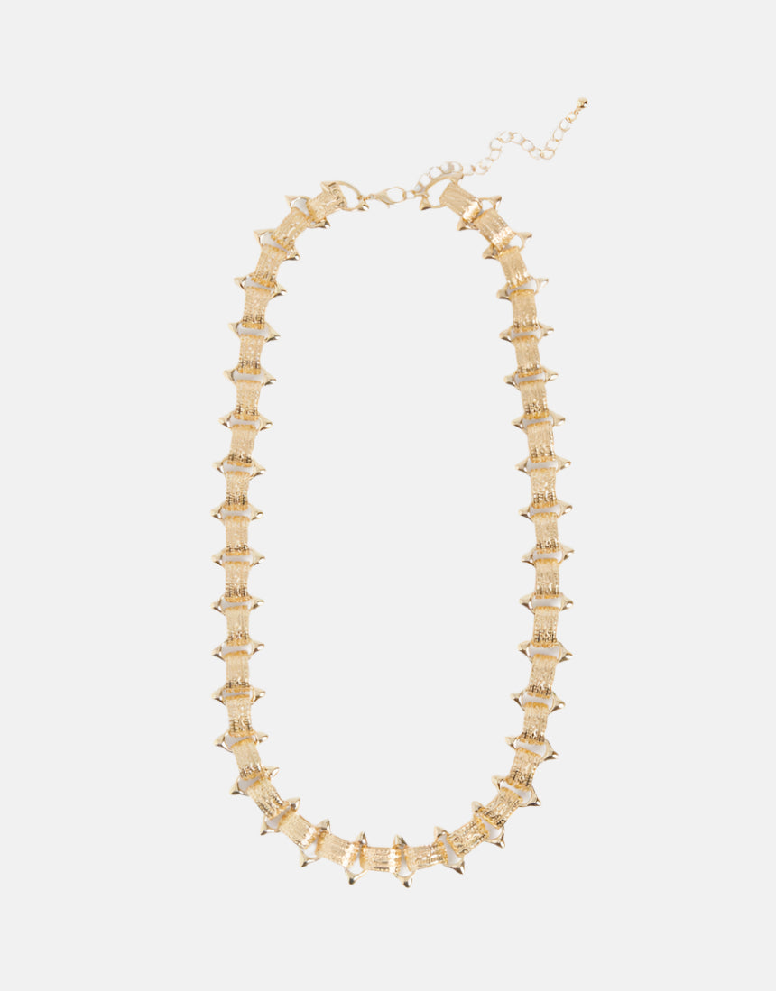 Elk Hvass gold necklace featuring a delicate chain and minimalist pendant, stylish jewelry for everyday wear.